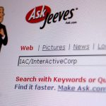 Illustration of a butler standing beside the Ask Jeeves logo and a search field on a web page.